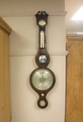 A 19th century inlaid mahogany aneroid barometer