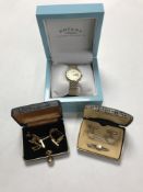 A boxed Rotary wristwatch together with assorted cufflinks and a Bakelite cased magnetic marching