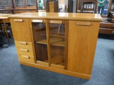A late twentieth century teak sideboard