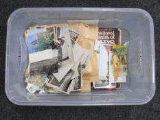 A box containing stamps and stamp magazines,