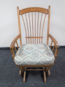 An oak glider armchair