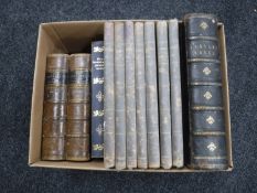 A box containing antiquarian volumes including leather bound Bunyan's Works, seven Punch volumes,