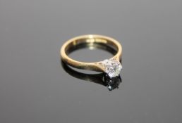 An 18ct gold solitaire diamond ring, the brilliant cut stone weighing approximately 0.