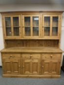 A pine farm house glazed kitchen dresser,