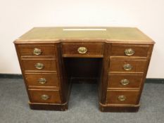 A Victorian oak inverted break-front pedestal desk,