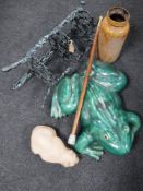 A three tier cast metal table, pottery garden frog ornament, cat figure,