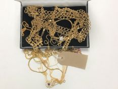A box of gilt metal chains etc.