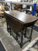 An oak barley twist gate leg table