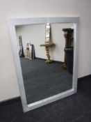A silver framed mirror