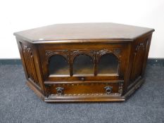 An oak linenfold audio cabinet