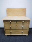 An antique pine four drawer chest