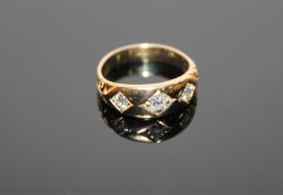 An 18ct gold old cut three stone diamond ring, the total diamond weight estimated at 0.