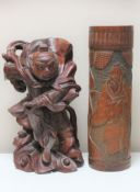 An oriental carved hardwood figure of a warrior,