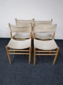 A set of four mid twentieth century beech Hessian dining chairs