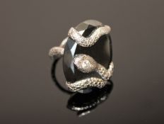 An unusual 18ct white gold and diamond set snake ring