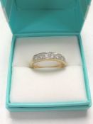 A 14ct gold half eternity ring, size N/O.