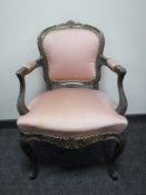 A French salon armchair upholstered in a pink fabric