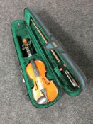 A modern violin and bow in case,