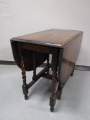 An oak barley twist gate leg table and an antique occasional table