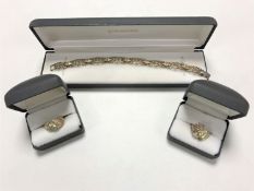 A sterling silver three tone bracelet and matching pair of dress rings.