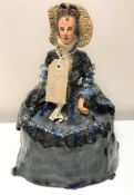 A pottery figure of Elizabeth I