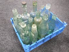 A crate of antique glass bottles