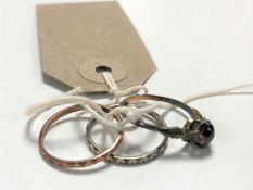 Two 9ct gold band rings together with a dress ring set with a cabochon stone.