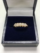 A 14ct gold five stone ring size O