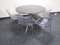 A set of six Italian Calligaris L'eau designer clear dining chairs on metal legs with a black glass