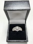 An 18ct white gold diamond encrusted ring, size U.