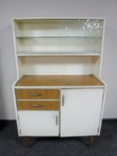 A mid twentieth century melamine and Formica kitchen cabinet