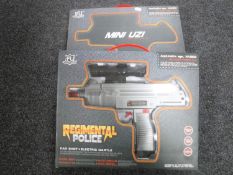 Two boxed Regimental Police 50AE toy uzi submachine guns