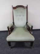 A Victorian mahogany gentleman's armchair upholstered in a green button dralon