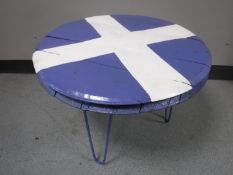 A whiskey barrel lid bearing the Scottish St. Andrew's Cross or Saltire