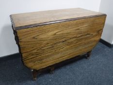 An oak pie crust edge gate leg table