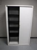 A Triumph shutter door stationary cabinet with key