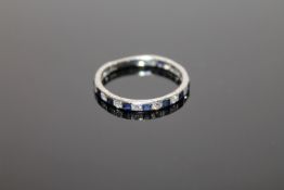 An 18ct white gold sapphire and diamond eternity ring CONDITION REPORT: Size V.