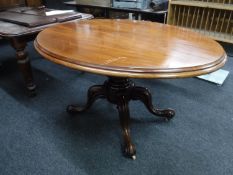 A Victorian oval tilt top breakfast table