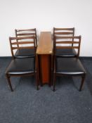 A teak drop leaf table and four chairs