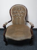 A mahogany spoon back chair upholstered in a button dralon fabric