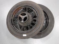 A pair of vintage wheels with fire stone tires