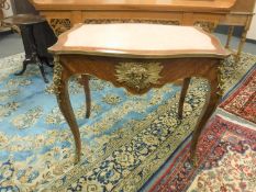 An inlaid walnut marble topped and ormolu mounted centre table,