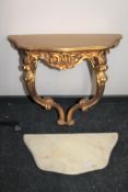 An ornate gilt marble topped hall table