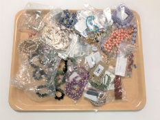 A silver necklace together with beads,