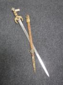 An ornamental sword in scabbard with jeweled hilt