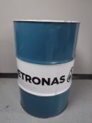 An oil drum with Petronas advertising