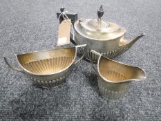 A silver three piece tea service,