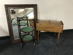 An early 20th century carved oak framed mirror,