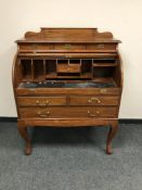 An inlaid mahogany cylinder bureau,