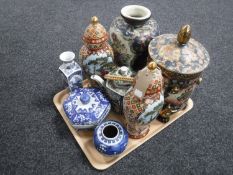 A tray of oriental wares to include lidded jar, vases, teapot,